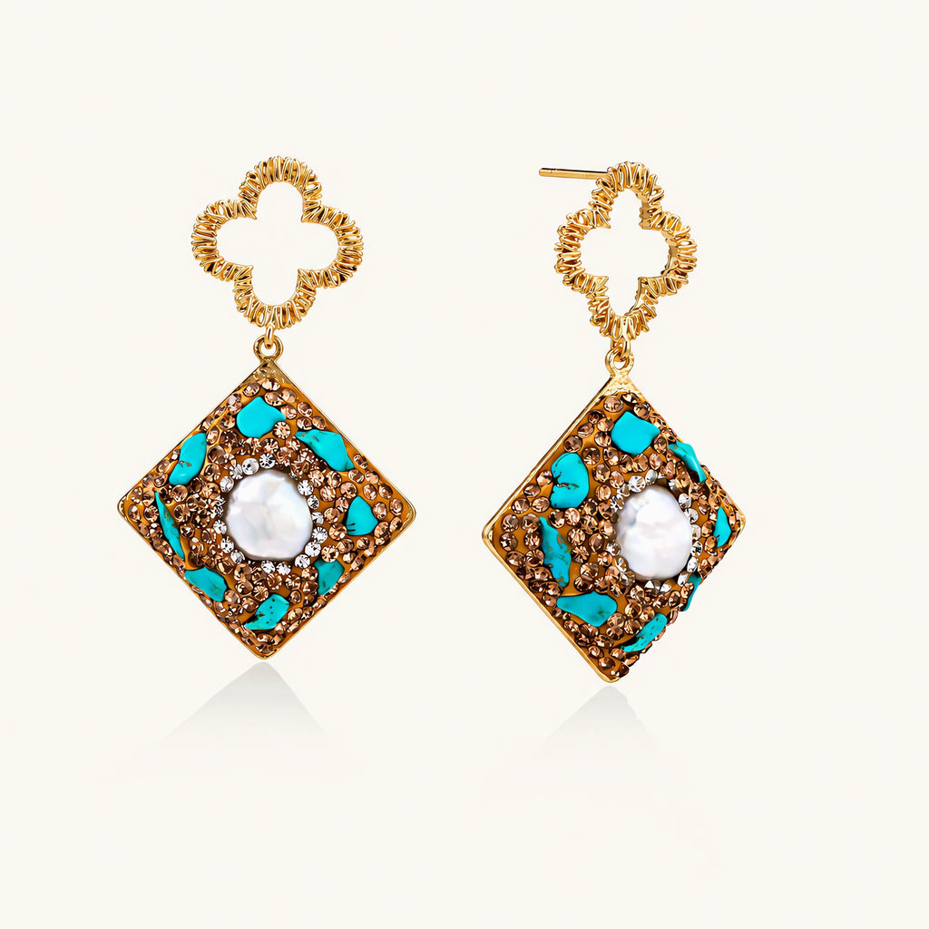 Gold-plated drop earrings with quatrefoil studs, diamond-shaped pendants featuring baroque pearls, turquoise stones, and amber crystals