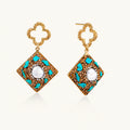 Gold-plated drop earrings with quatrefoil studs, diamond-shaped pendants featuring baroque pearls, turquoise stones, and amber crystals
