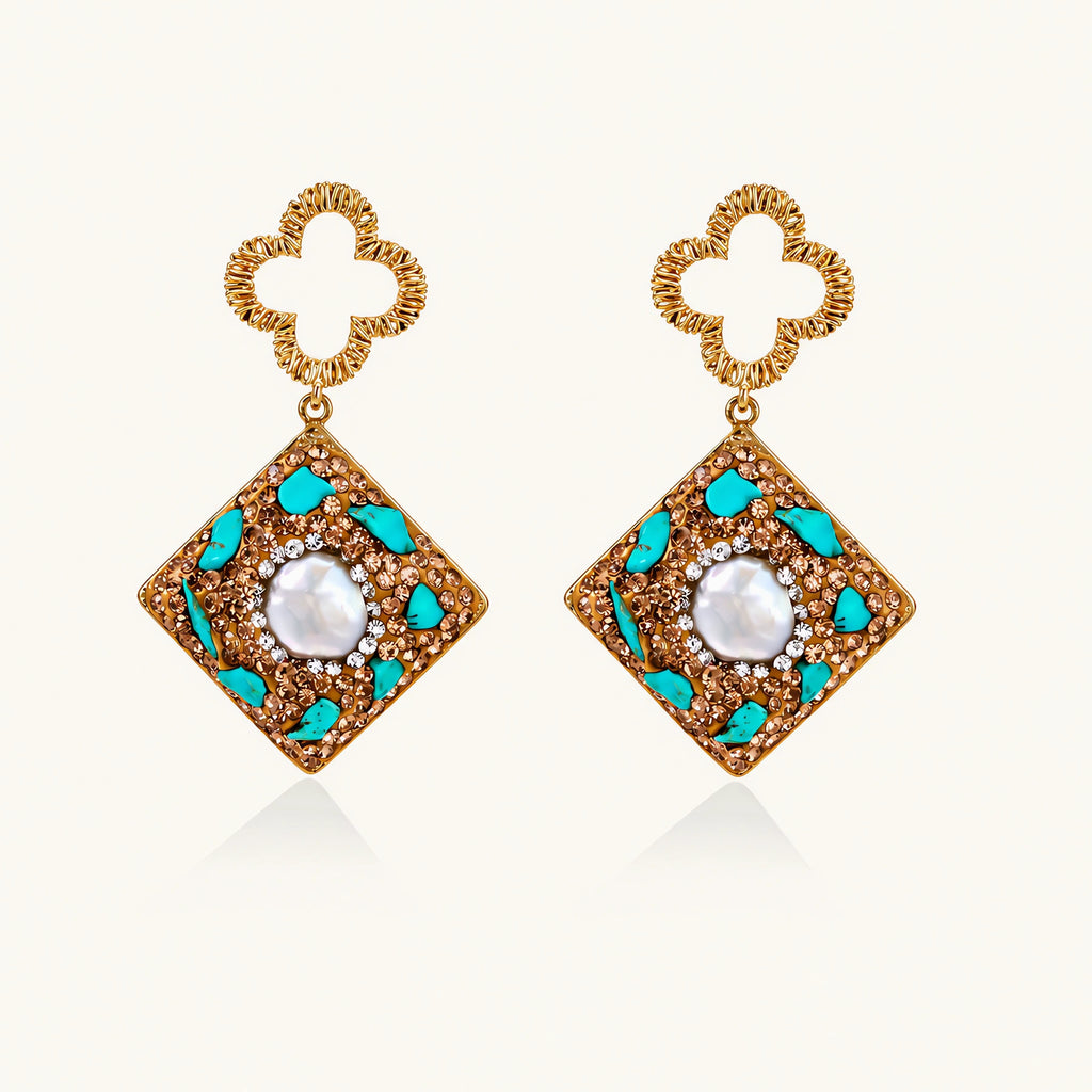 Gold-plated drop earrings with quatrefoil studs, diamond-shaped pendants featuring baroque pearls, turquoise stones, and amber crystals