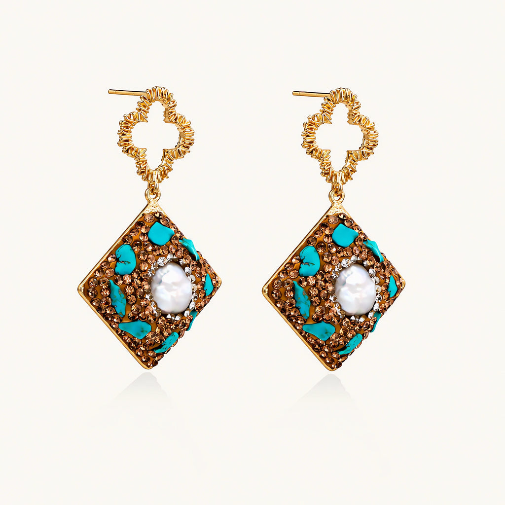 Gold-plated drop earrings with quatrefoil studs, diamond-shaped pendants featuring baroque pearls, turquoise stones, and amber crystals
