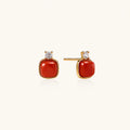 18K gold vermeil stud earrings with cushion-cut red agate stones and sparkling crystal accents on beige background