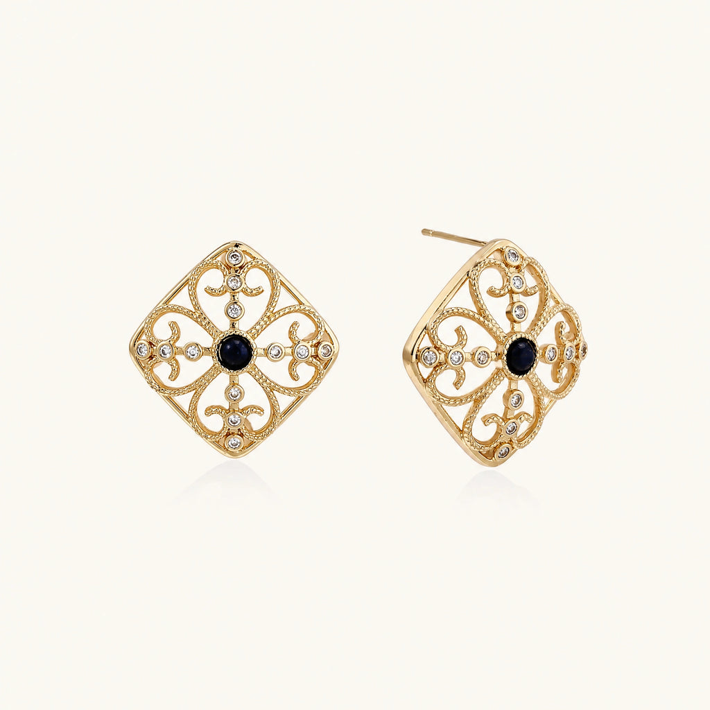 Gold filigree stud earrings with navy lapis lazuli center stone and mother-of-pearl accents in ornate quatrefoil design