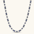 Antique silver plated eco-brass link necklace with blue baguette and round cubic zirconia in ornate scrollwork settings.